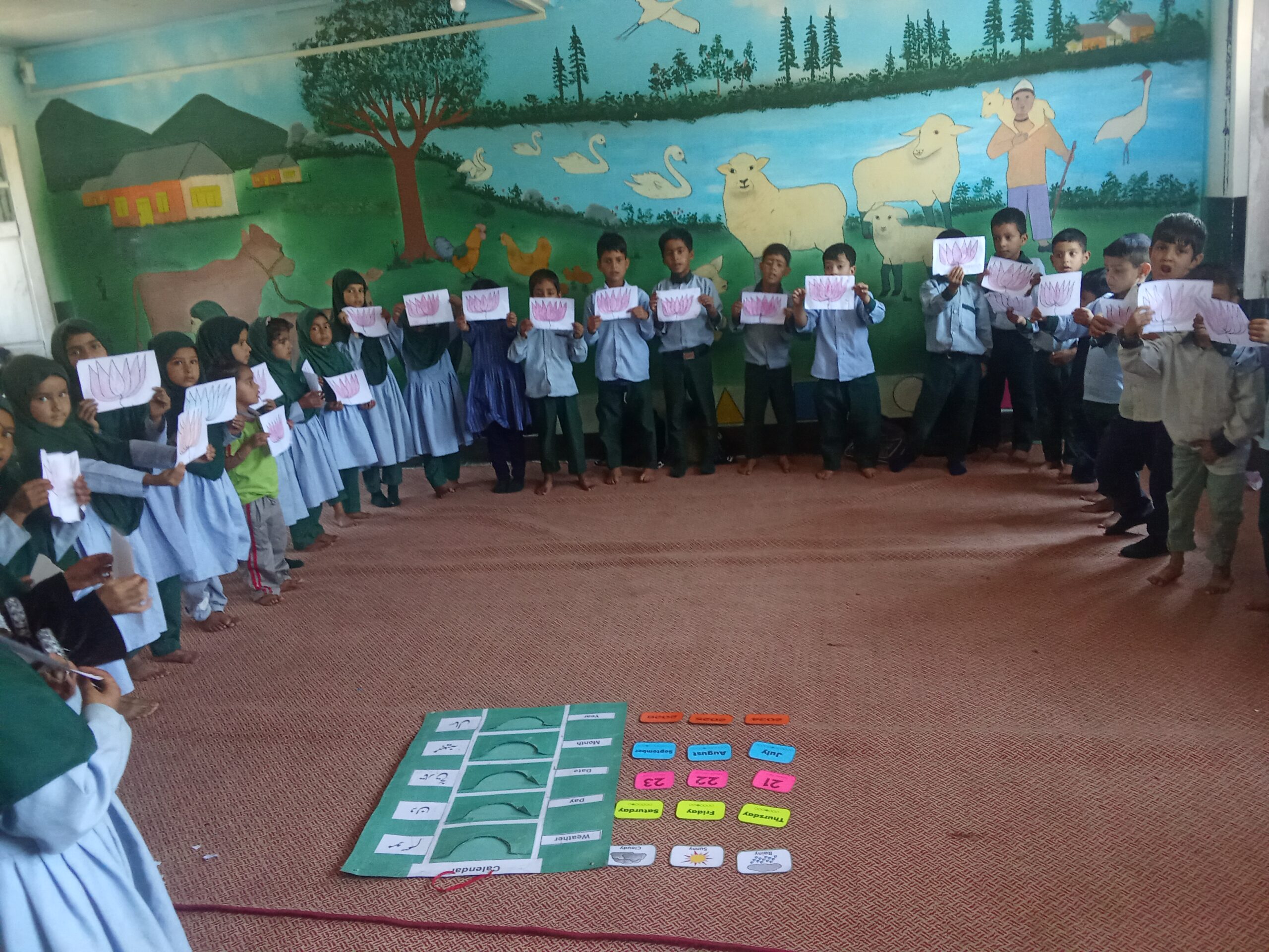 engaging in creative work in model classroom bandipora